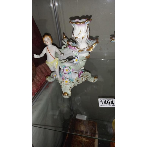 1464 - A pair of glazed continental porcelain cherub comport candlesticks