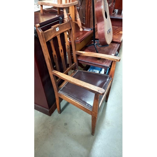 1497 - An arts and crafts oak carver chair with tulip cut out back slats, COLLECT ONLY