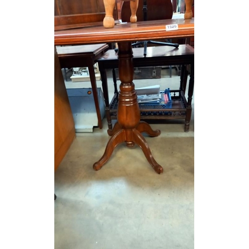 1520 - An octagonal mahogany tea table on centre column, 92cm x 61cm x 78cm high, COLLECT ONLY