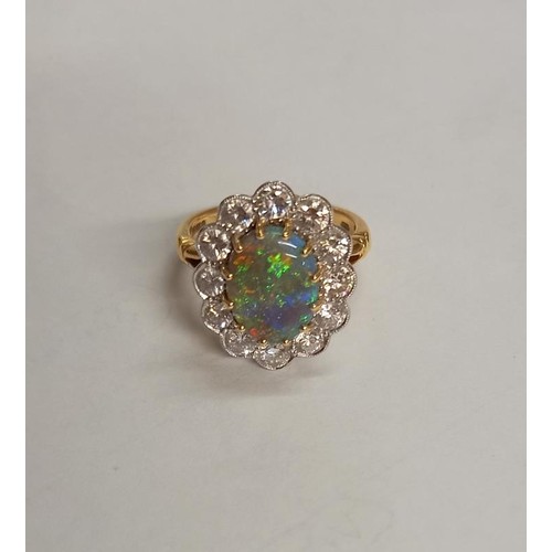 2030E - An 18ct gold opal and diamond ring, size M, total weight 6.8 grams.