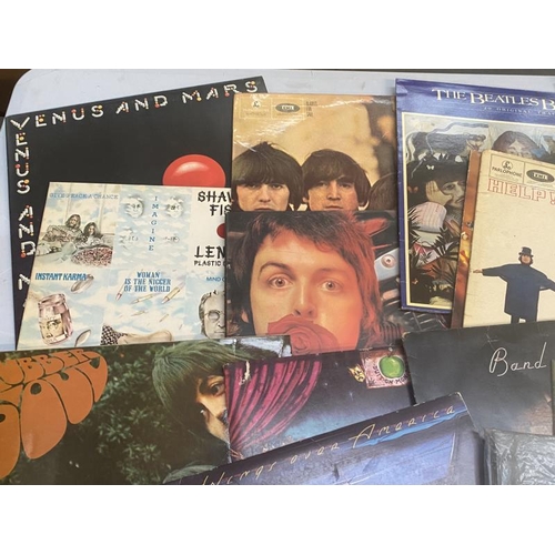 83 - A quantity of The Beatles Fab Four records in mostly good condition