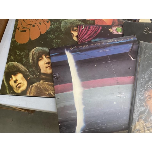 83 - A quantity of The Beatles Fab Four records in mostly good condition