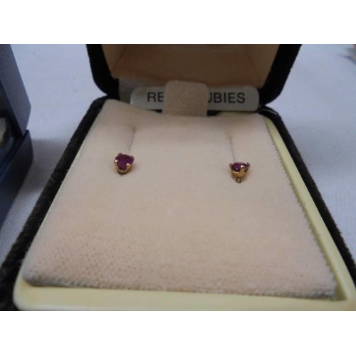 1001 - A pair of 9ct gold anchor earrings, a pair of ruby earrings and three other pairs of un-marked yello... 