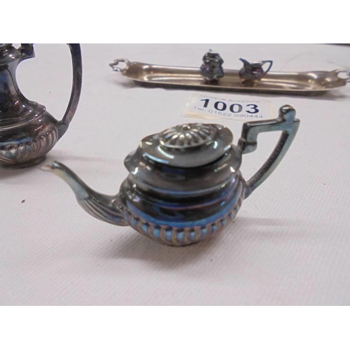 1003 - A miniature four piece tea set on a silver tray, D H & S, Birmingham 1973, 65 grams.