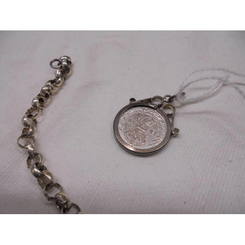 1007 - Two silver bracelets and a silver threepenny bit pendant.