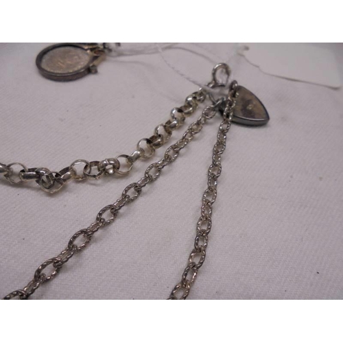 1007 - Two silver bracelets and a silver threepenny bit pendant.