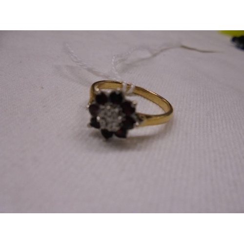 1020 - An 18ct gold cluster ring, size M, 2.9 grams.