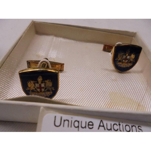 1031 - Two pairs of cuff links marked 18ct front and back, a pair of Royal Horse Artilery cuff links and a ... 