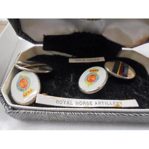 1031 - Two pairs of cuff links marked 18ct front and back, a pair of Royal Horse Artilery cuff links and a ... 