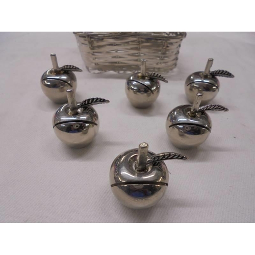 1035 - A silver plate basket and six silver plate place card holders in the shape of apples.