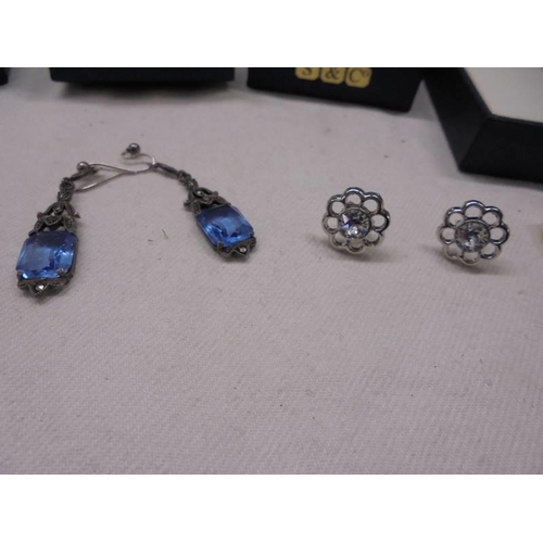 1054 - A silver pendant, three pairs of silver earrings (one missing butterfly clips) and two other pairs o... 