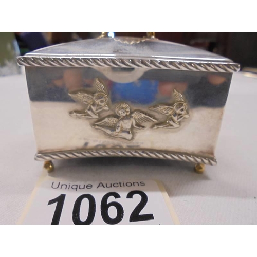 1062 - A hall marked silver musical trinket box, (not working).