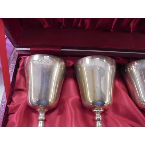 1065 - A cased set of six silver goblets, maker C S G & Co., Birmingham 1972.  With original purchase recei... 