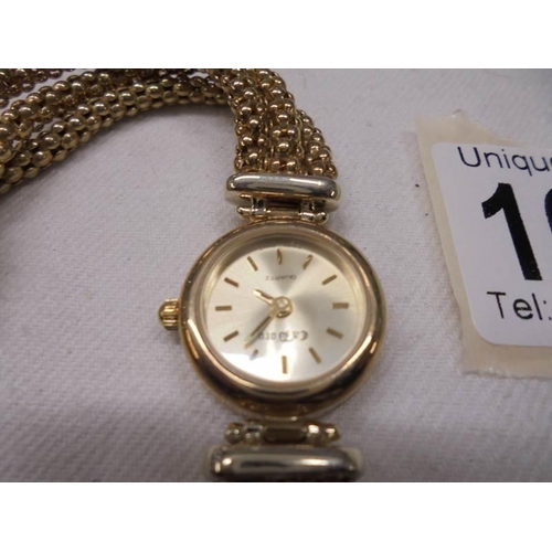 1066 - A 9ct gold ladies wrist watch on a 9ct gold bracelet, total weight 26.5 gram.