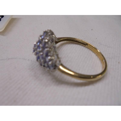 1068 - A 9ct gold ring set multiple blue stones, size U, 3 grams.