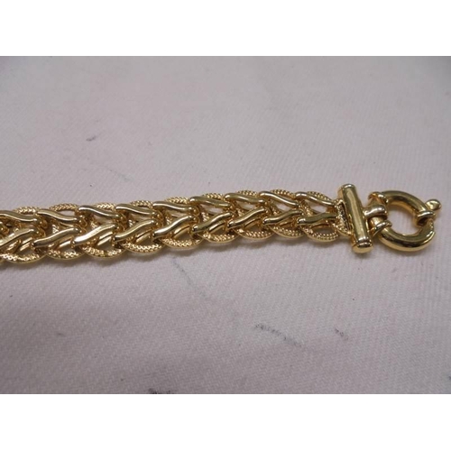 1077 - A 9ct gold bracelet, 13.6 grams.