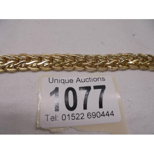 1077 - A 9ct gold bracelet, 13.6 grams.