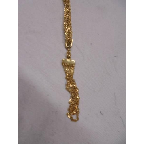 1081 - A 9ct gold multi chain necklace, 8.3 grams.