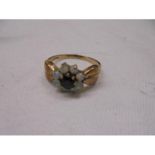 1091 - A 9ct gold ring set opal cluster, Size t, 3.5 grams.