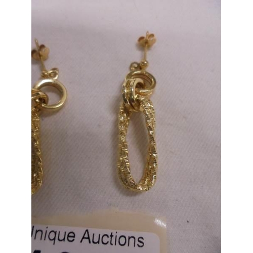 1099 - A pair of 9ct gold earrings, size 3.4 grams.