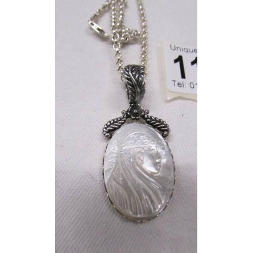 1104 - A good quality silver pendant on heavy silver chain, 24.7 grams.