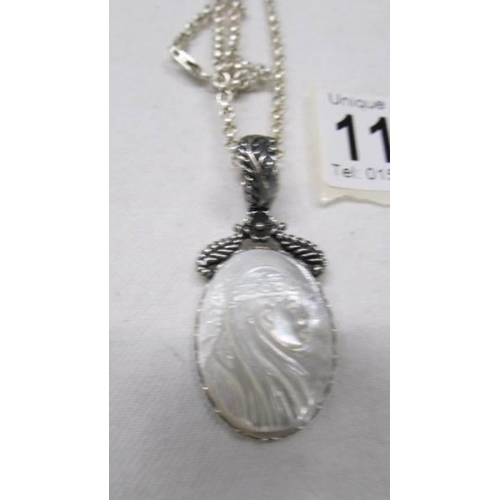 1104 - A good quality silver pendant on heavy silver chain, 24.7 grams.