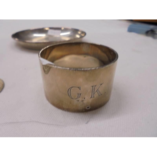 1114 - A silver topped scent bottle, silver pin tray, silver napkin ring, silver book mark and an a/f pill ... 