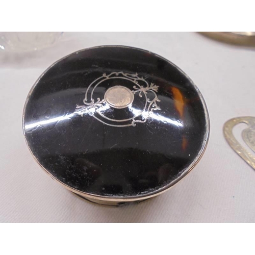 1114 - A silver topped scent bottle, silver pin tray, silver napkin ring, silver book mark and an a/f pill ... 