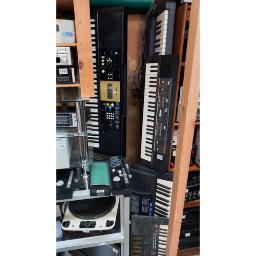 1160 - A Roland ''sound canvas'' 3 Yamaha and a Casio keyboard with stand