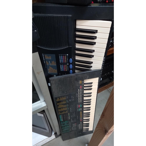 1160 - A Roland ''sound canvas'' 3 Yamaha and a Casio keyboard with stand