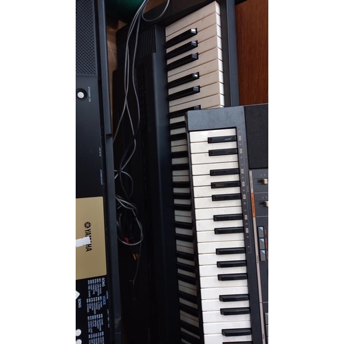 1160 - A Roland ''sound canvas'' 3 Yamaha and a Casio keyboard with stand