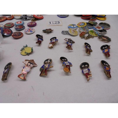 1123 - A mixed lot of badges including Robinsons, petrol. agricultural etc.,