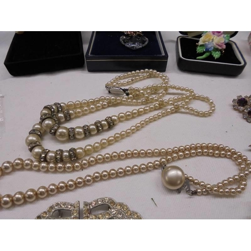 1126 - A mixed lot of good quality brooches, pearl necklaces etc.,