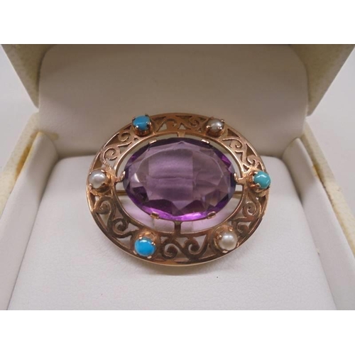 1129 - A good quality yellow metal brooch set seed pearls, turquoise and large amethyst coloured stone. 10.... 