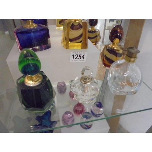 1254 - Four coloured glass scent bottles and two clear glass examples.