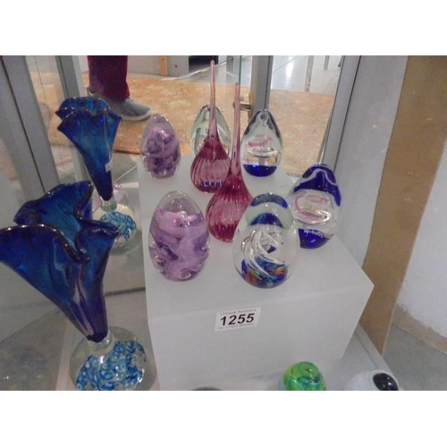 1255 - A studio glass vase and nine paperweights.