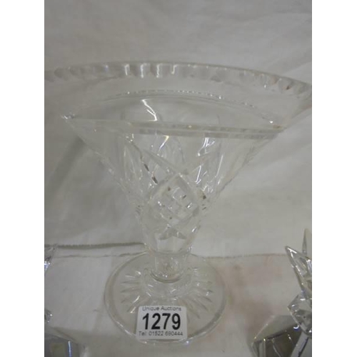 1279 - A cut glass vase and a pair of glass candlesticks.