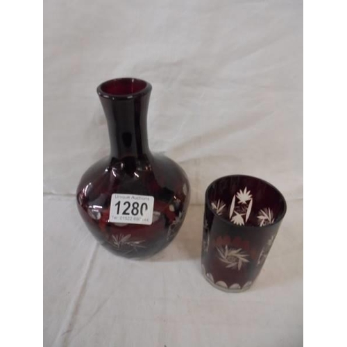 1280 - An overlaid ruby glass water carafe with matching tumbler.