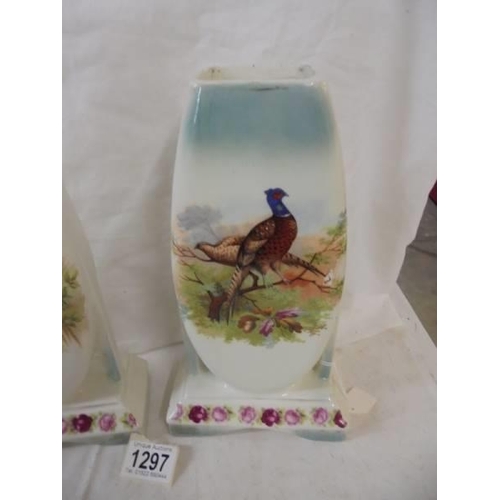 1297 - A pair of ceramic cases hand painted with pheasants.