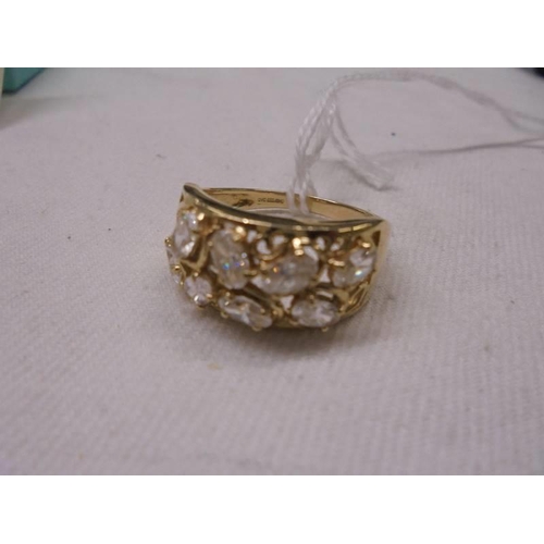 1141 - An 18ct gold ring set clear stones, size S, 5.2 grams.