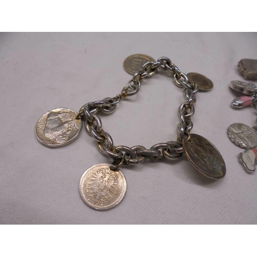 1143 - 3 charm bracelets - 1 with coins, 1 with 925 St. Christopher and a gate bracelet with 925 silver hea... 