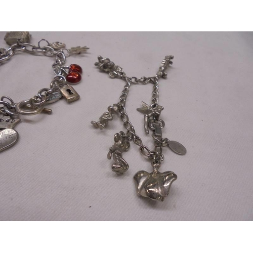 1143 - 3 charm bracelets - 1 with coins, 1 with 925 St. Christopher and a gate bracelet with 925 silver hea... 