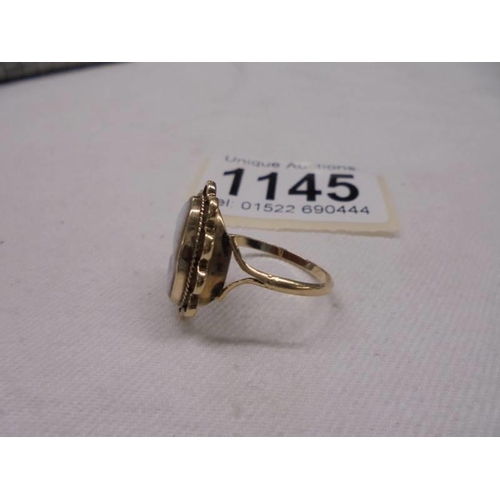 1145 - A cameo ring of a female profile dated 1973, hallmarked 9ct gold, size O, 2.6 grams.