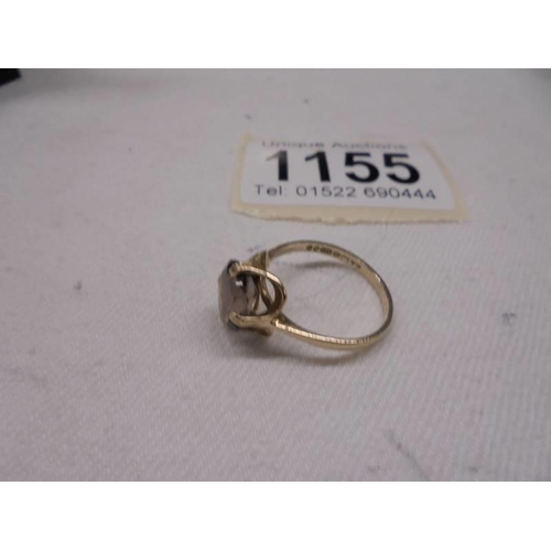 1155 - A Smoky quartz ring in 9ct gold dated 1980. Size L, 2 grams.