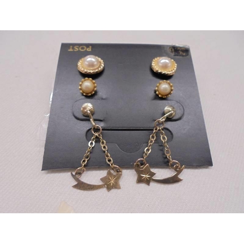 1158 - Three pairs on 9ct gold earrings, two with pearls and on pair designed as a shooting star.