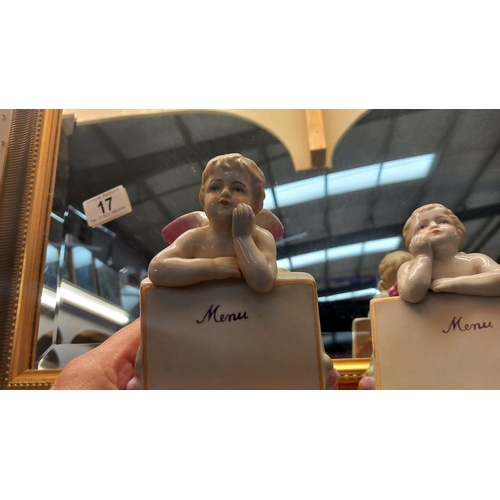 18 - A pair of continental bisque winged cherub menu holders