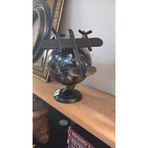 38 - A black world globe with metal plane