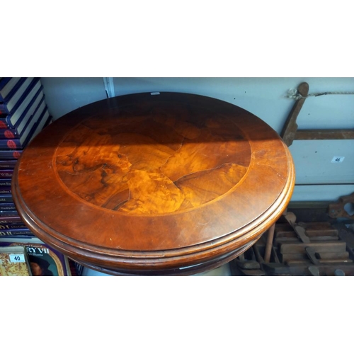 43 - A dark wood stained circular tripod table