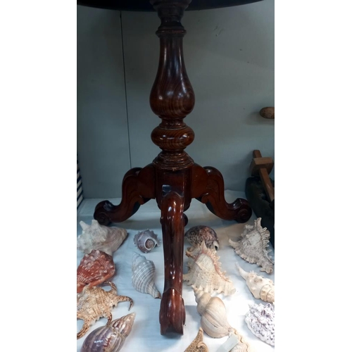 43 - A dark wood stained circular tripod table