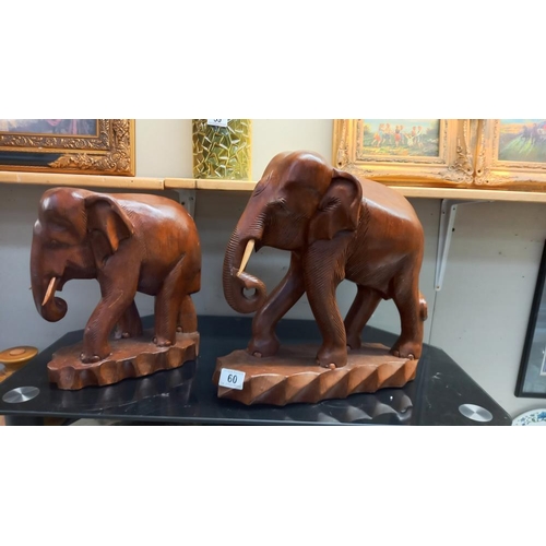 60 - 2 lovely vintage teak carvings of a bull and cow elephant height 31cm and 38cm COLLECT ONLY